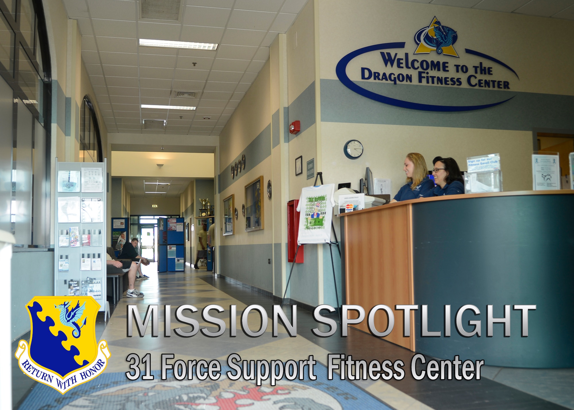Coleen Pasion, Dragon Fitness Center recreation aid, and Tanya McCormick, Fitness and Sports Center director, wait to greet patrons April 17, 2013 at the Dragon Fitness Center at Aviano Air Base, Italy.  The fitness center offers a variety of programs such as martial arts, pre-natal yoga and monthly fun runs. (U.S. Air Force illustration/Senior Airman Jessica Hines) 