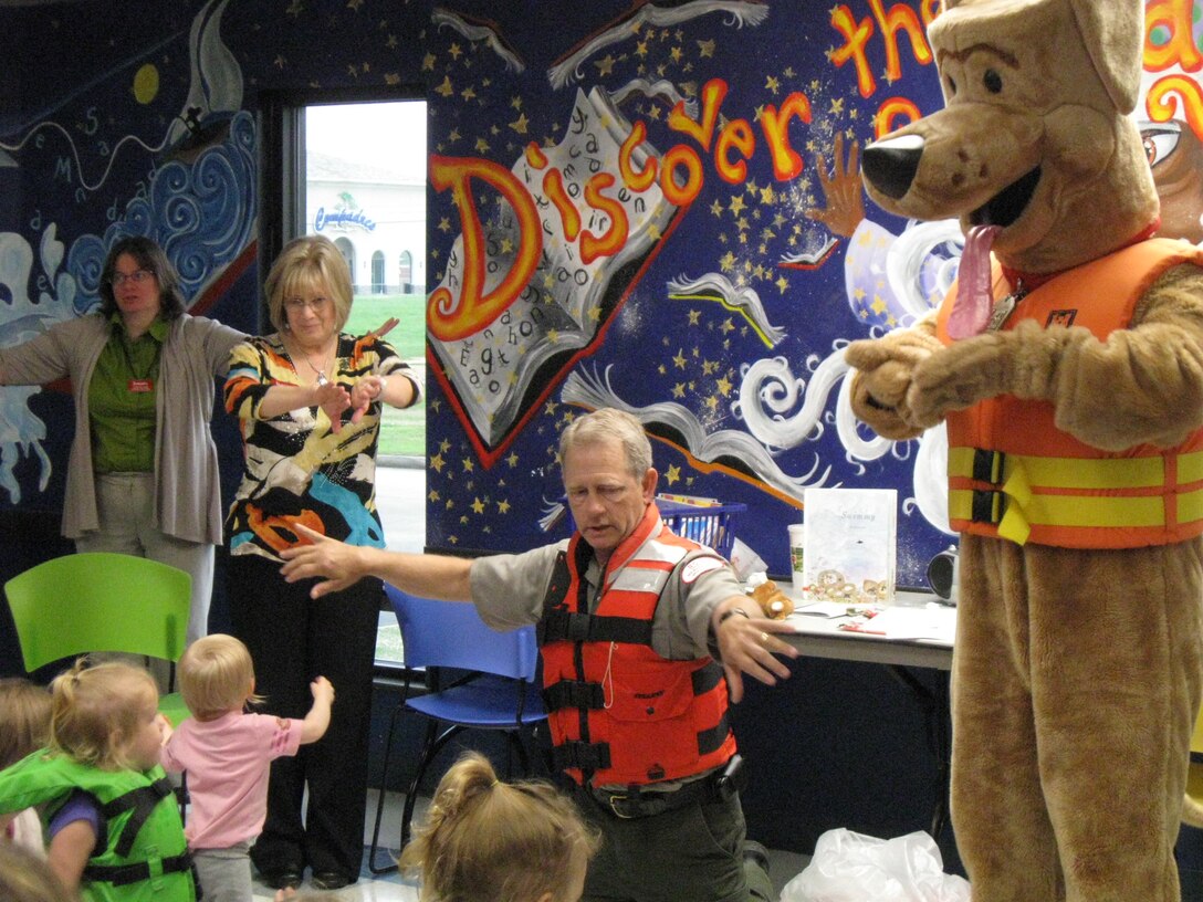 Park ranger Jim Montgomery and Bobber the Water Safety Dog visited area children and taught water safety during Storytime at the Broken Arrow South Library.