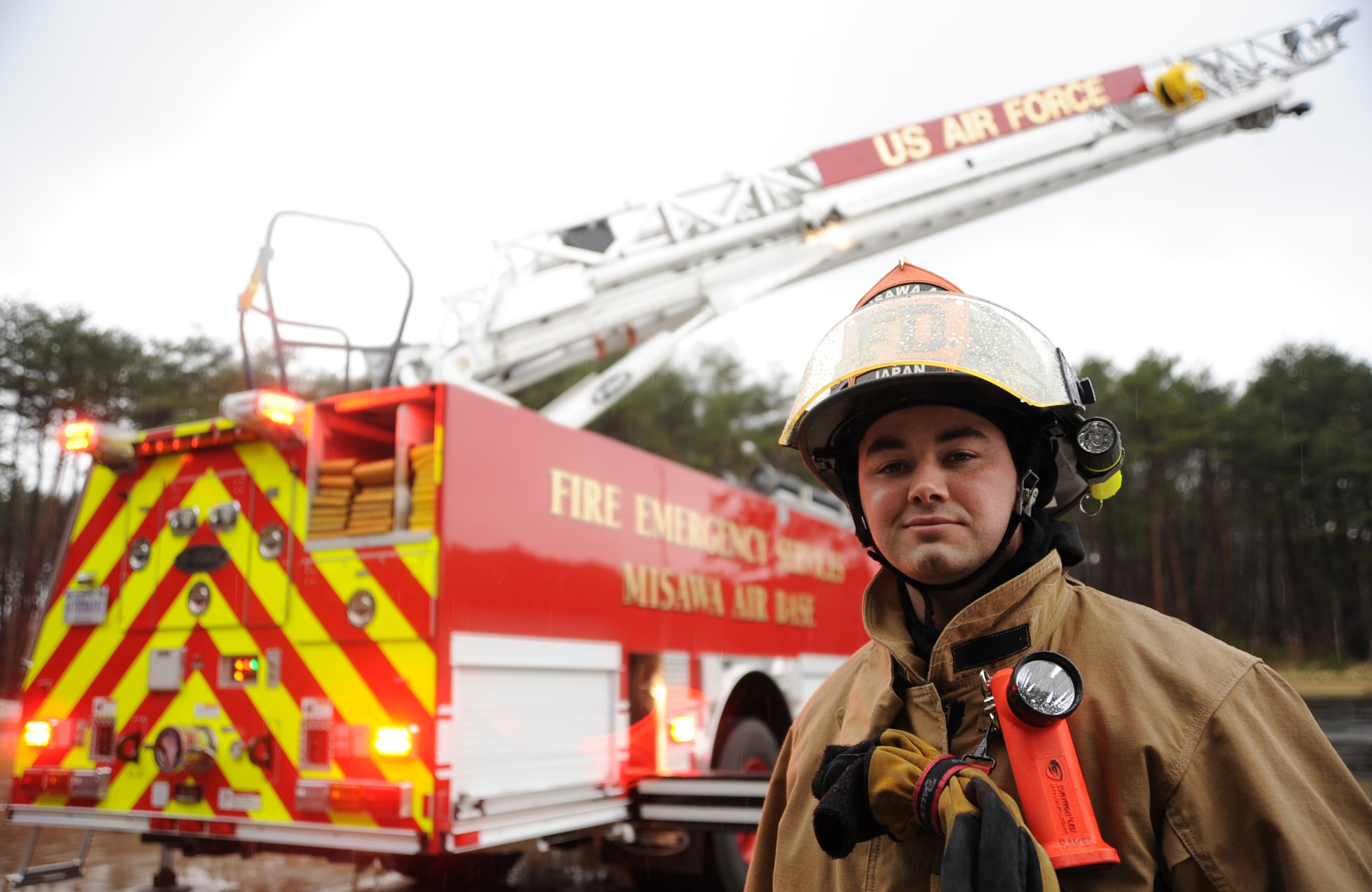 U.S. Air Force Senior Airman Bradley Baker, 35th Civil Engineer Squadron fire protection operator, stands outside the 35 CES fire station at Misawa Air Base, Japan, April 18, 2013. Baker was recently named the recipient of the Pacific Air Forces Scouting Salutes the Military Award, and has collectively served 20 years with the Boy Scouts of America where he currently volunteers as an assistant scout master. (U.S. Air Force photo by Senior Airman Derek VanHorn)