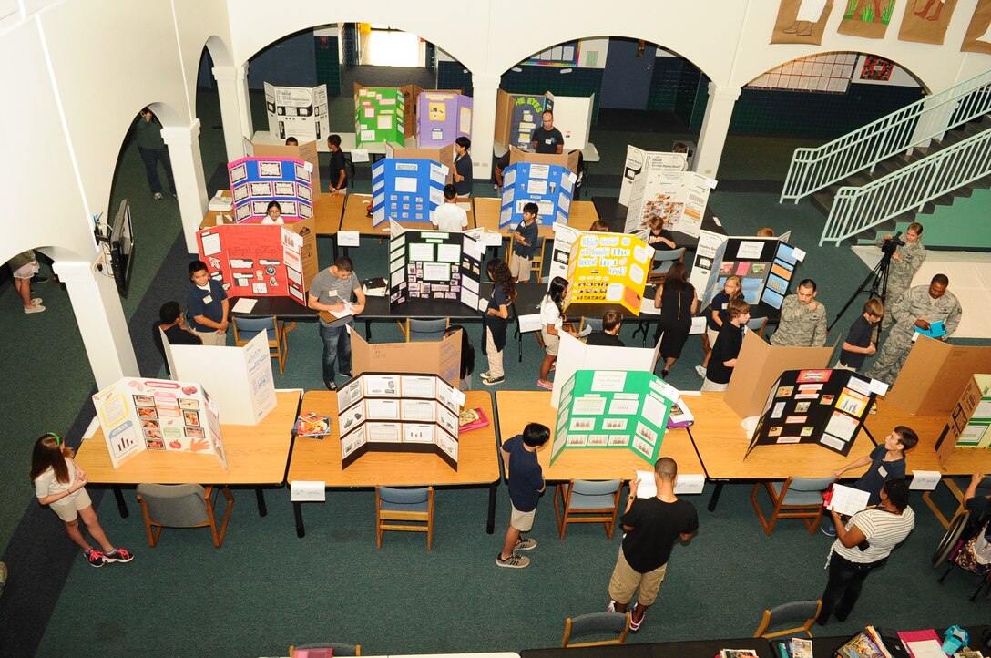 Andersen Middle School students present science fair projects to volunteer judges on Andersen Air Force Base, Guam, April 4, 2013. The science fair showcased the students’ creativity and scientific knowledge. (U.S. Air Force photo by Airman 1st Class Adarius Petty/Released)