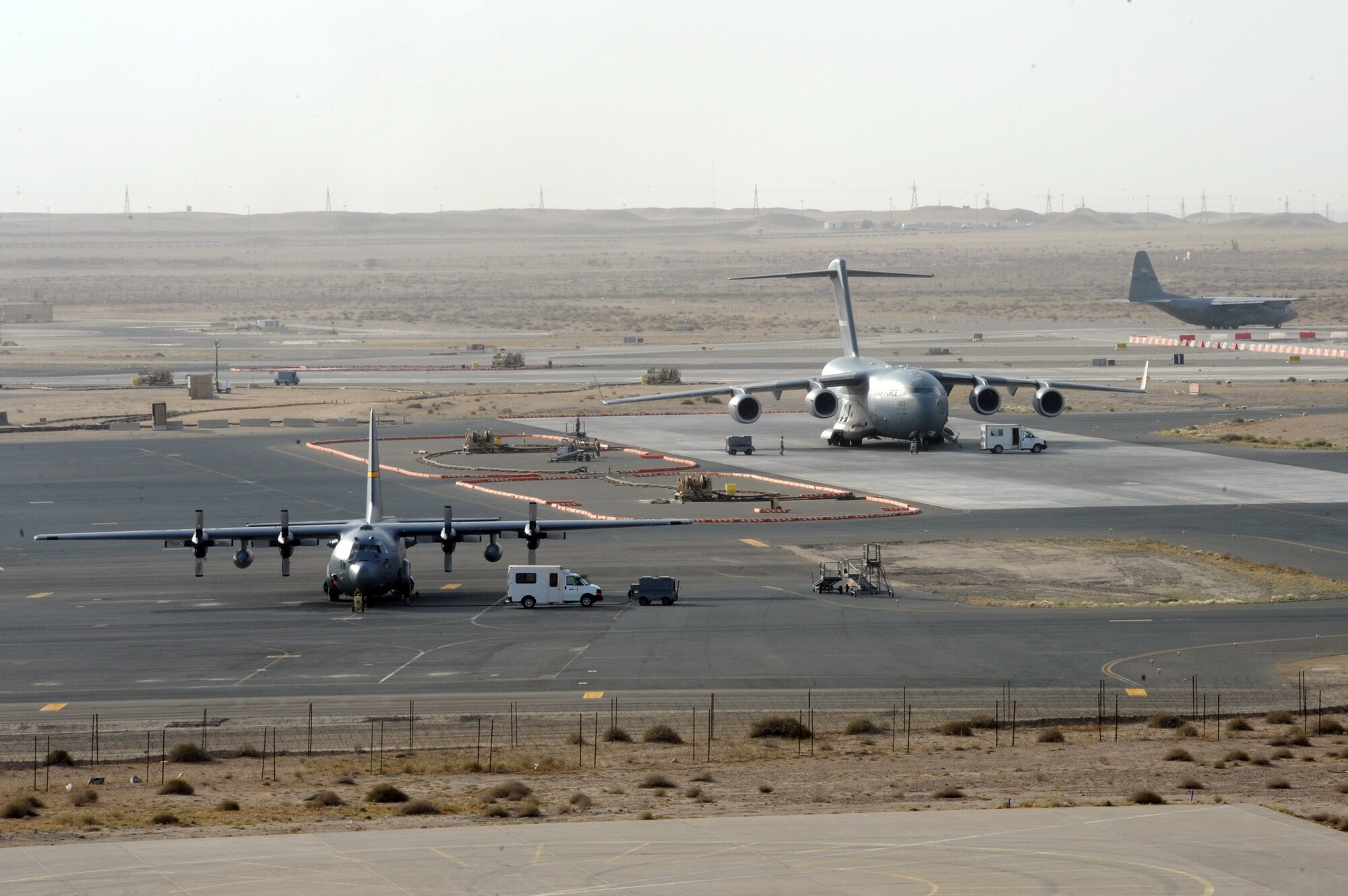 An Air Mobility Command C-130 Hercules deployed from the Texas Air National Guard prepares to depart the 386th Air Expeditionary Wing, Southwest Asia Apr 21, 2013. The C-130 Hercules primarily performs the tactical portion of the airlift mission. The aircraft is capable of operating from rough, dirt strips and is the prime transport for airdropping troops and equipment into hostile areas. (U.S. Air Force photo by Senior Master Sgt. George Thompson)