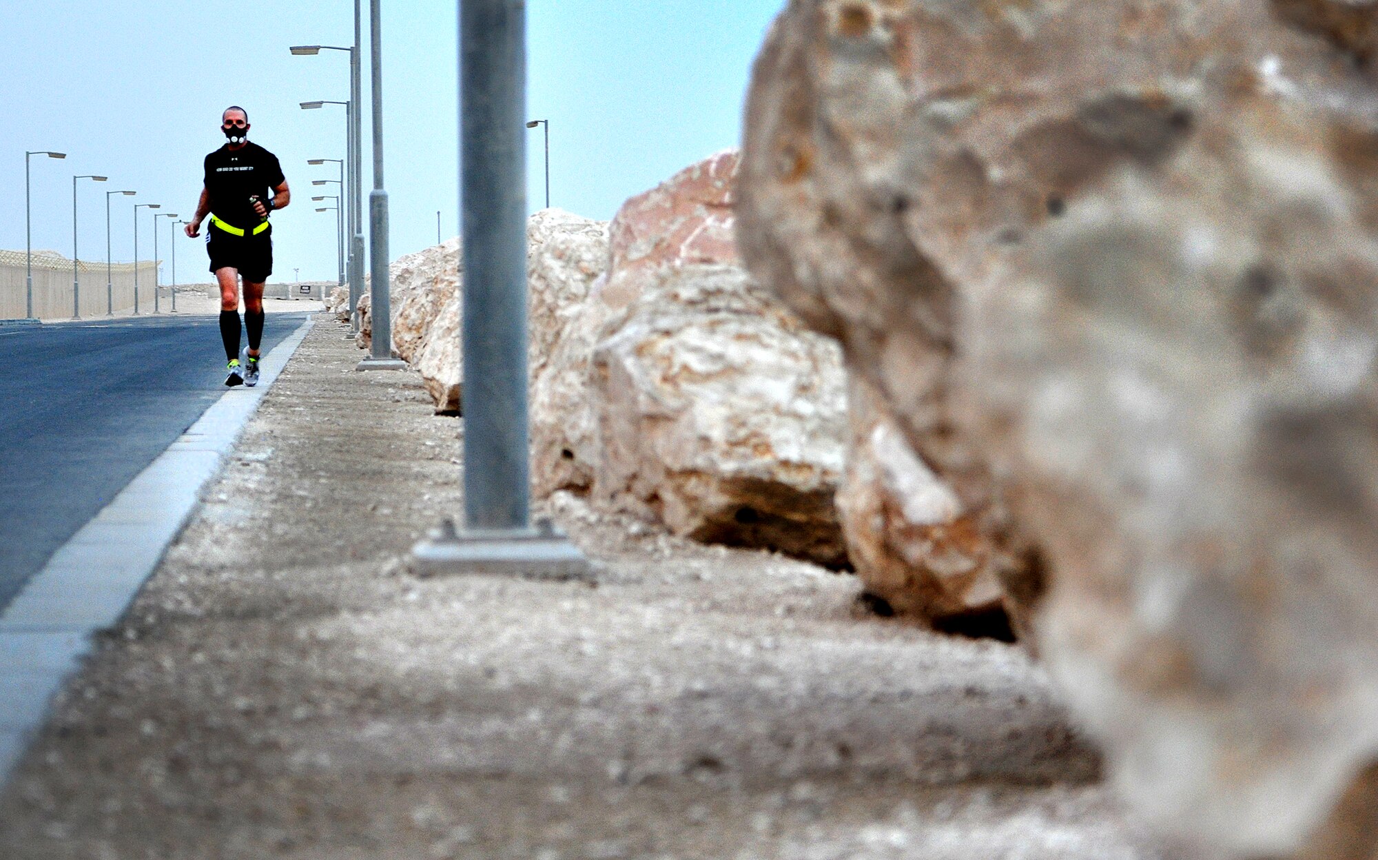 Master Sgt. Robert R. Snyder Jr., Air Forces Central force protection liaison officer, runs several miles around a base in an undisclosed location in Southwest Asia, April 17. Snyder is a native of Pana, Ill. (U.S. Air Force photo by Staff Sgt. Rachelle Elsea)