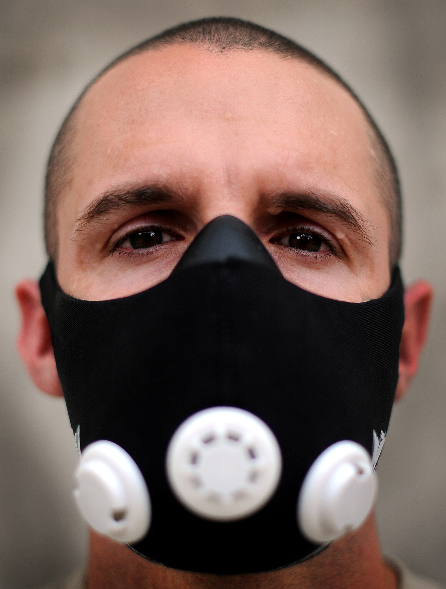 Master Sgt. Robert R. Snyder Jr., Air Forces Central Force Protection liaison officer, wears an elevation training mask, in an effort to improve his cardio and ability to endure higher terrain. Snyder is deployed from Scott Air Force Base, Ill. (U.S. Air Force photo by Technical Sgt. Raymond Hoy)