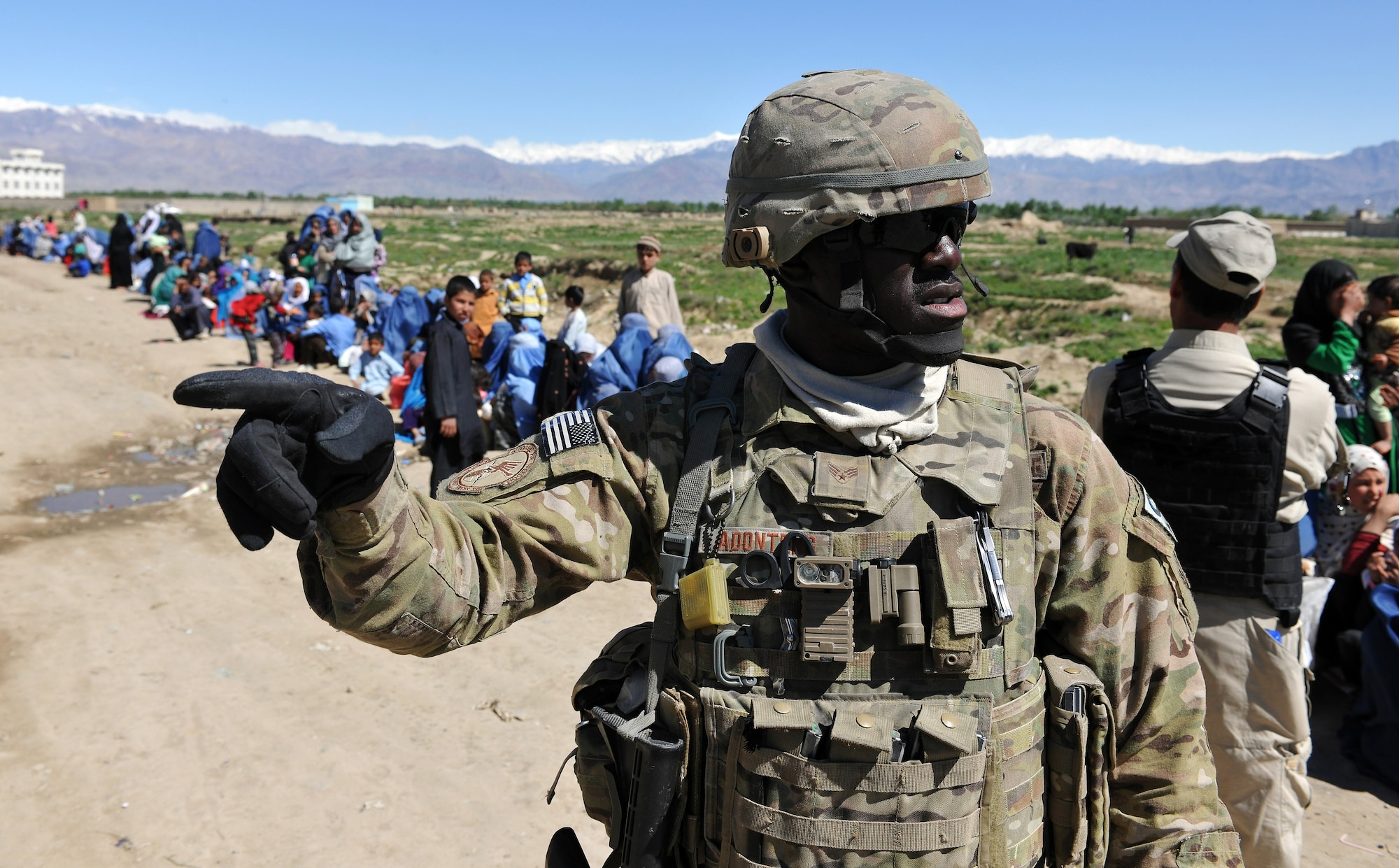 Senior Airman Evans Adonteng, 455th Expeditionary Security Forces Squadron entry controller, patrols the area outside the medical entry control point at Bagram Airfield, Afghanistan, April 16, 2013.  The 455th ESFS teams patrol the base perimeter looking for suspicious activities while local Afghan civilians arrive to receive basic medical care.  (U.S. Air Force photo/Senior Airman Chris Willis)