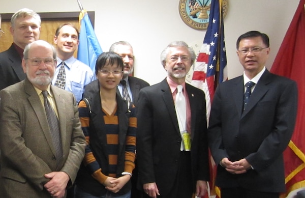 Photo of USACE IWR personnel and visitors from Singapore. Front row (left to right): Mr. Bob Brumbaugh, IWR; Ms. Kee Sanyin, Singapore Housing and Development Board, Infrastructure and Reclamation Department; Mr. Bob Pietrowsky, IWR Director; Mr. Chua Kok Eng, Singapore Housing and Development Board, Infrastructure and Reclamation Department. Back row (left to right): Dr. Joe Manous, IWR; Dr. Hal Cardwell, IWR, Mr. Andy Bruzewicz, USACE Headquarters. 