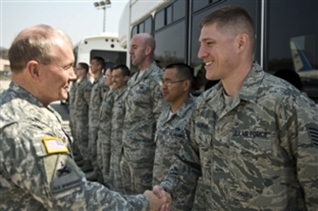 U.S. Army Gen. Martin E. Dempsey, left, chairman of the Joint Chiefs of Staff, talks with U.S. Air Force Tech. Sgt. Galpeau on Osan Air Base, South Korea, April 20, 2013. 
