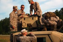 Marines with Combat Logistics Battalion 6, 2nd Marine Logistics Group assemble the M153 Common Remotely Operated Weapon Station before conducting a live fire during a training exercise aboard Camp Lejeune, N.C., April 18, 2013. Servicemembers with the battalion performed approximately 40 hours of classroom instruction familiarizing the Marines with the weapon system.