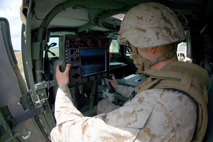 Lance Cpl. Ryan M. Morrisssette, a North Providence, R.I., native and motor transportation operator with Combat Logistics Battalion 6, 2nd Marine Logistics Group, fires the M153 Common Remotely Operated Weapon Station using the display control panel to identify the target during a training exercise aboard Camp Lejeune, N.C., April 18, 2013. The CROWS is divided into four sections, which are the display control panel, control grip, weapon station and main processing unit.