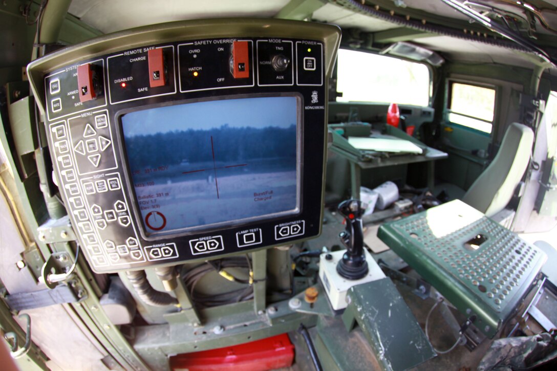 Marines with Combat Logistics Battalion 6, 2nd Marine Logistics Group fire the M153 Common Remotely Operated Weapon Station using the display control panel to identify the target and control grip to rotate the CROWS during a training exercise aboard Camp Lejeune, N.C., April 18, 2013.  Approximately 40 Marines with the battalion were trained for a week on how to use the CROWS in preparation for a future deployment to Afghanistan. 