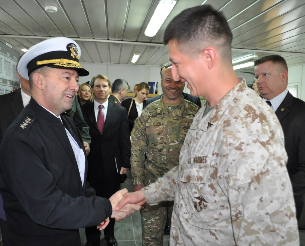 Admiral James G. Stavridis, the supreme allied commander for Europe and commander of U.S. European Command shakes hands with a Lance Cpl assigned to the Georgia Training Team during a tour to visit U.S. personnel currently working with the Republic of Georgia armed forces and government agencies. 