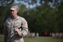 Sgt. Maj. John E. Bankus, the outgoing sergeant major of 8th Engineer Support Battalion, 2nd Marine Logistics group, prepares to relinquish his sword of office and position to his successor during a relief and appointment ceremony aboard Camp Lejeune, N.C., April, 18, 2013. Bankus served as the battalion’s sergeant major for 21 months.