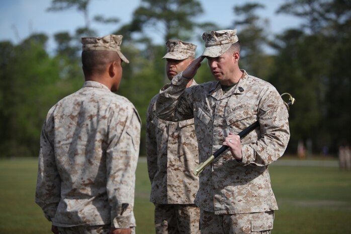 Sgt. Maj. John E. Bankus (right), the outgoing sergeant major of 8th Engineer Support Battalion, 2nd Marine Logistics Group, salutes Lt. Col. Ferdinand F. Llantero, the unit’s battalion commander (left), during a relief and appointment ceremony aboard Camp Lejeune, N.C., April 18, 2013. Bankus relinquished his position as battalion sergeant major to 1st Sgt. Monroe C. Boykin.