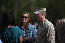 Sgt. Maj. John E. Bankus (right) and his wife Chief Petty Officer Jill B. Bankus (center) speak with guests after the relief and appointment for 8th Engineer Support Battalion, 2nd Marine Logistics Group aboard Camp Lejeune, N.C., April 18, 2013. Bankus will move to Marine Corps Base Camp Pendleton, Calif., where he will join Headquarters Battalion, School of Infantry West.