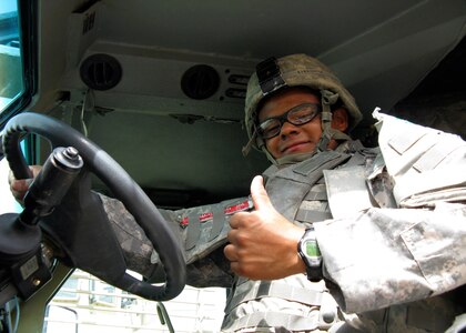 Army Spc. Noe Barrientos, who hails from Corpus Christi, Texas, gives the thumbs-up signal as he prepares to head out from Camp Liberty, Iraq, on a mission, Aug. 13, 2008. Barrientos is a combat engineer with the 836th Sapper Company, 890th Engineer Battalion, 926th Engineer Brigade, Multinational Division Baghdad.