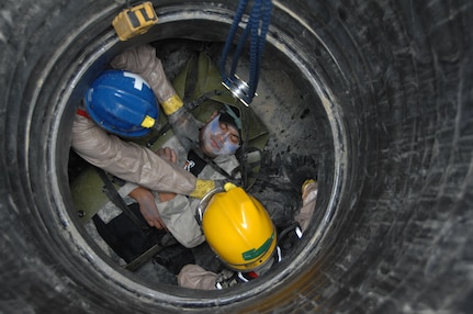 Ohio National Guardmembers from the Chemical, Biological, Radiological, Nuclear and high-yield Explosive (CBRNE) Enhanced Response Force Package (CERFP) extract a "victim" during a disaster response exercise at the Owens Community College campus in Perrysburg Township near Toledo August 14.