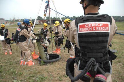 Ohio National Guardmembers from the Chemical, Biological, Radiological, Nuclear and high-yield Explosive (CBRNE) Enhanced Response Force Package (CERFP) extract a "victim" during a disaster response exercise at the Owens Community College campus in Perrysburg Township near Toledo August 14.