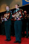 Spc. Jeremy Whipple, left, and Staff Sgt. Michael Noyce-Merino are applauded after they were announced as the winners of Soldier and NCO of the Year in the 2008 Army National Guard "Best Warrior" Competition at the Enlisted Association of the National Guard of the United States' annual awards banquet in Savannah, Ga., Aug. 21. Both Soldiers advance to the Department of the Army competition, scheduled for October at Fort Lee, Va.