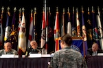 Spc. Rebecca Bell, a health care specialist with the 466th Area Support Medical Company, poses a question to Command Sgt. Maj. John Gipe, left, Command Sgt. Maj. David Ray Hudson, and retired Sgt. Maj. of the Army Jack Tilley, during a question and answer session with senior enlisted leaders during the 37th annual meeting of the Enlisted Association of the National Guard of the United States, in Savannah, Ga., Wednesdsay, Aug. 20, 2008.