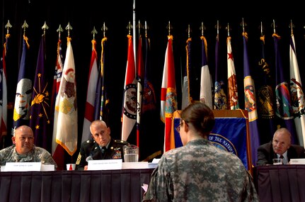 Spc. Rebecca Bell, a health care specialist with the 466th Area Support Medical Company, poses a question to Command Sgt. Maj. John Gipe, left, Command Sgt. Maj. David Ray Hudson, and retired Sgt. Maj. of the Army Jack Tilley, during a question and answer session with senior enlisted leaders during the 37th annual meeting of the Enlisted Association of the National Guard of the United States, in Savannah, Ga., Wednesdsay, Aug. 20, 2008.