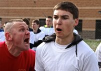 Gunnery Sgt. Caesar Mazzeo, a Drill Instructor from Marine Corps Recruit Depot San Diego, gives a little motivation to Poolee Ireland from RSS Niles during RS Lansing’s Mini-boot Camp South April, 20. Poolees from across southern Michigan attended the three day training event at Fort Custer in Battle Creek, Mich. in order to better prepare them for Recruit Training.  