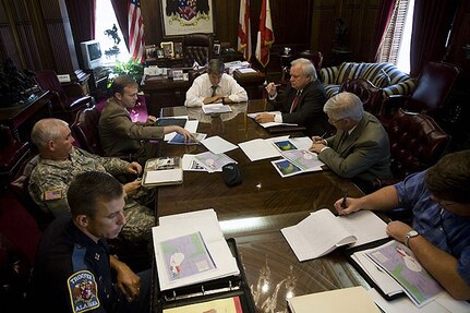 Alabama Gov. Bob Riley (end of table) meets with Army Maj. Gen. A.C. Blalock, the Alabama National Guard's adjutant general (center, left) and other state agency leaders Aug. 27, 2008, to discuss preparations for Tropical Storm Gustav, which is expected to be a Category 3 hurricane when it makes landfall. Thousands of National Guard members from states along the Gulf Coast have been mobilized or put on alert as the tropical storm gains strength and heads toward the United States.