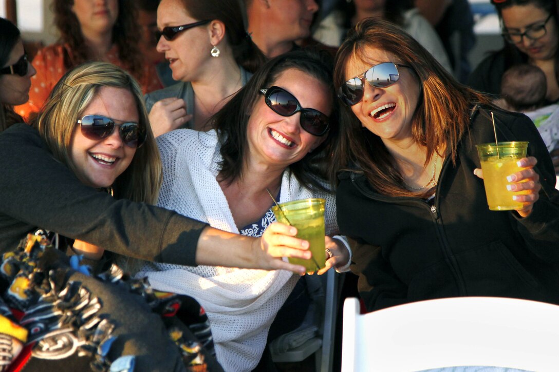 (Left to right) Tara Yarte, Danni Maxwell and Sonnia Endora laugh together before the Live, Laugh and Learn event at the Del Mar Beach Resort here April 19. The tour features motivational presentations, book signing and author meet-and-greet events for military wives.

