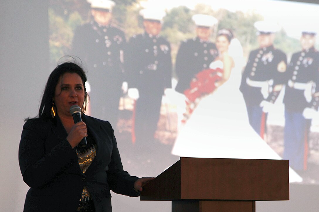 Kristine Schellhaas speaks about the major events, good and bad, that have affected her life as a military spouse during the Live, Laugh and Learn event at the Del Mar Beach Resort here April 19. The Live, Laugh and Learn tour features motivational presentations, book signing and author meet-and-greet events for military wives. 