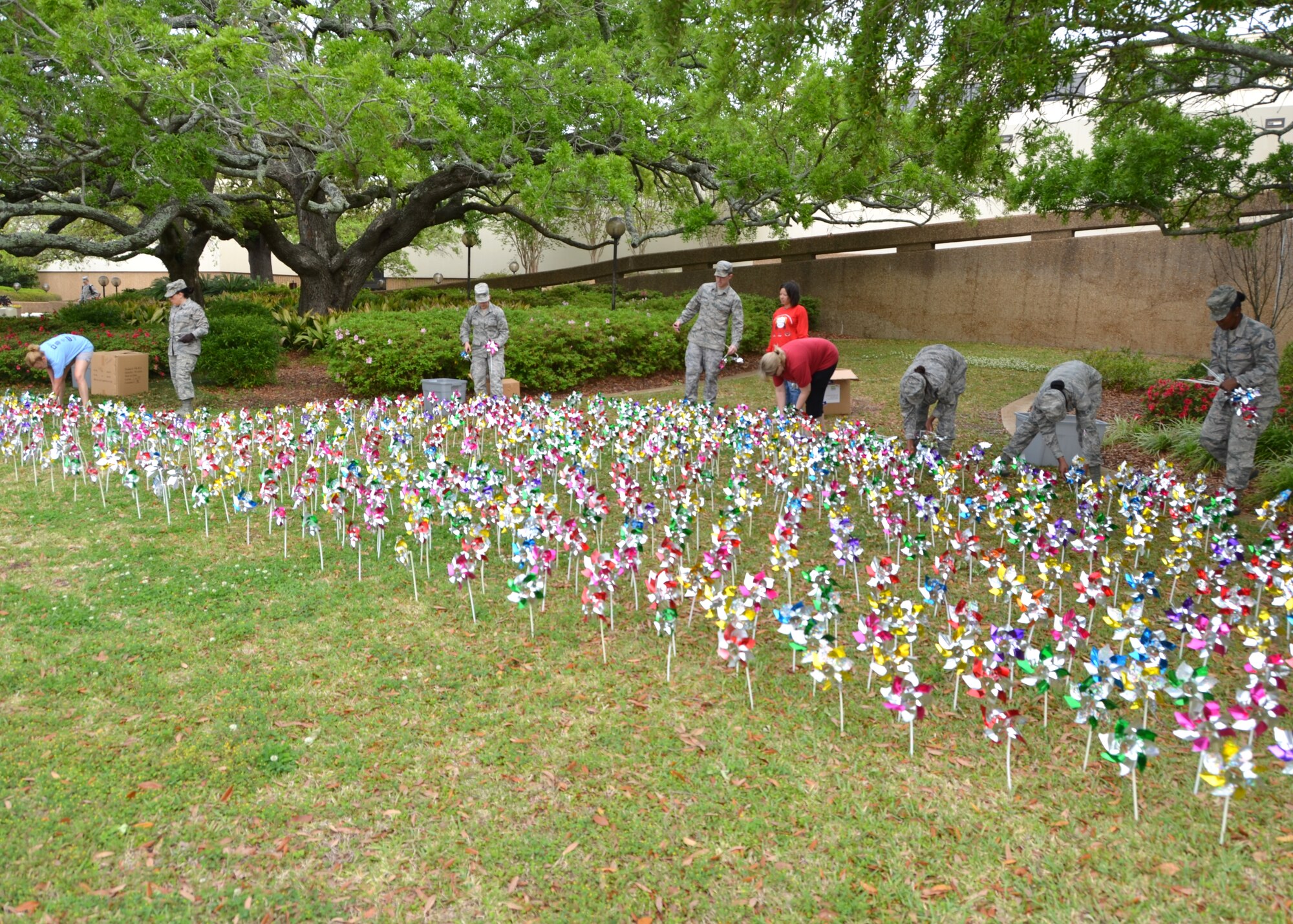 Members of the 81st Medical Operations Squadron Mental Health Flight place pinwheels in front of Keesler Medical Center April 16. Each pinwheel in the display represents one of the nearly 1,300 children who were substantiated for abuse or neglect in Harrison and Jackson counties in 2012. Since 2007, the Keesler Family Advocacy Program has used ‘Pinwheels for Prevention’ every April as part of Child Prevention Month to remind the base population that the prevention of child abuse and neglect is everyone’s responsibility. (U.S. Air Force photo by Steve Pivnick)