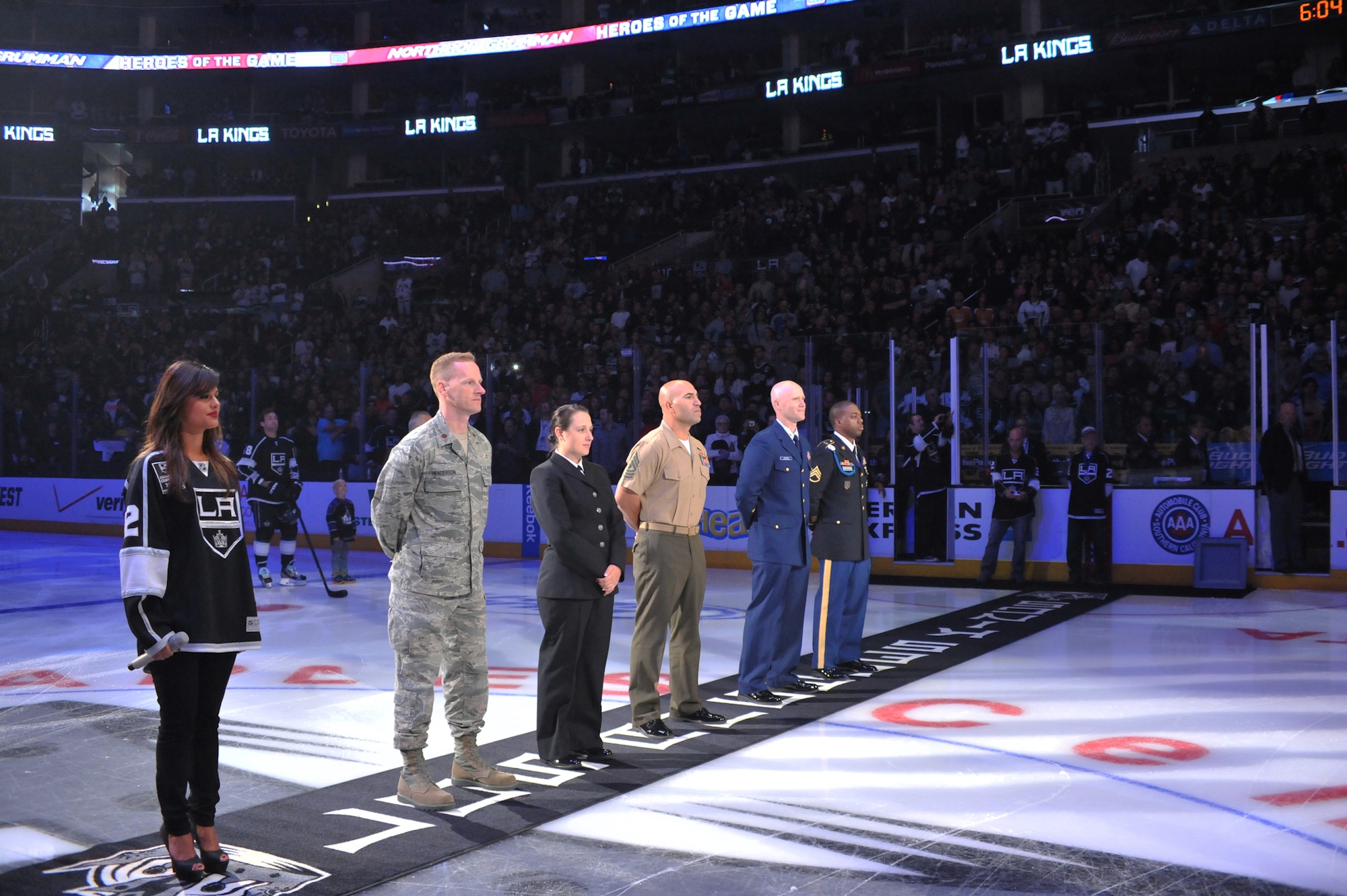 Service members stand on center ice at the LA Kings hockey game, April 21.  (Photo by Sarah Corrice)