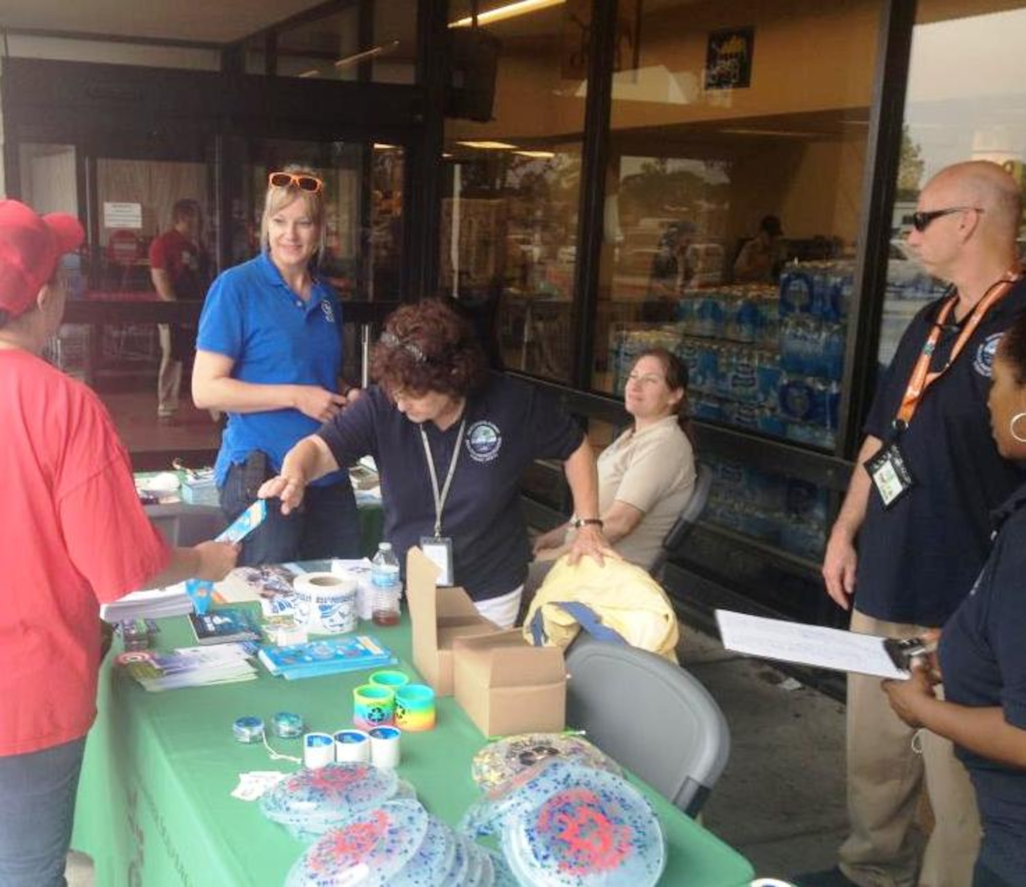 The 325th Civil Engineer Squadron environmental element, the 325th CES Natural Resources office and Balfour Beatty Communities distributed Earth friendly information April 19 outside the Base Commissary in spirit of Earth Day. (U.S. Air Force photo by Senior Airman Christopher Reel)