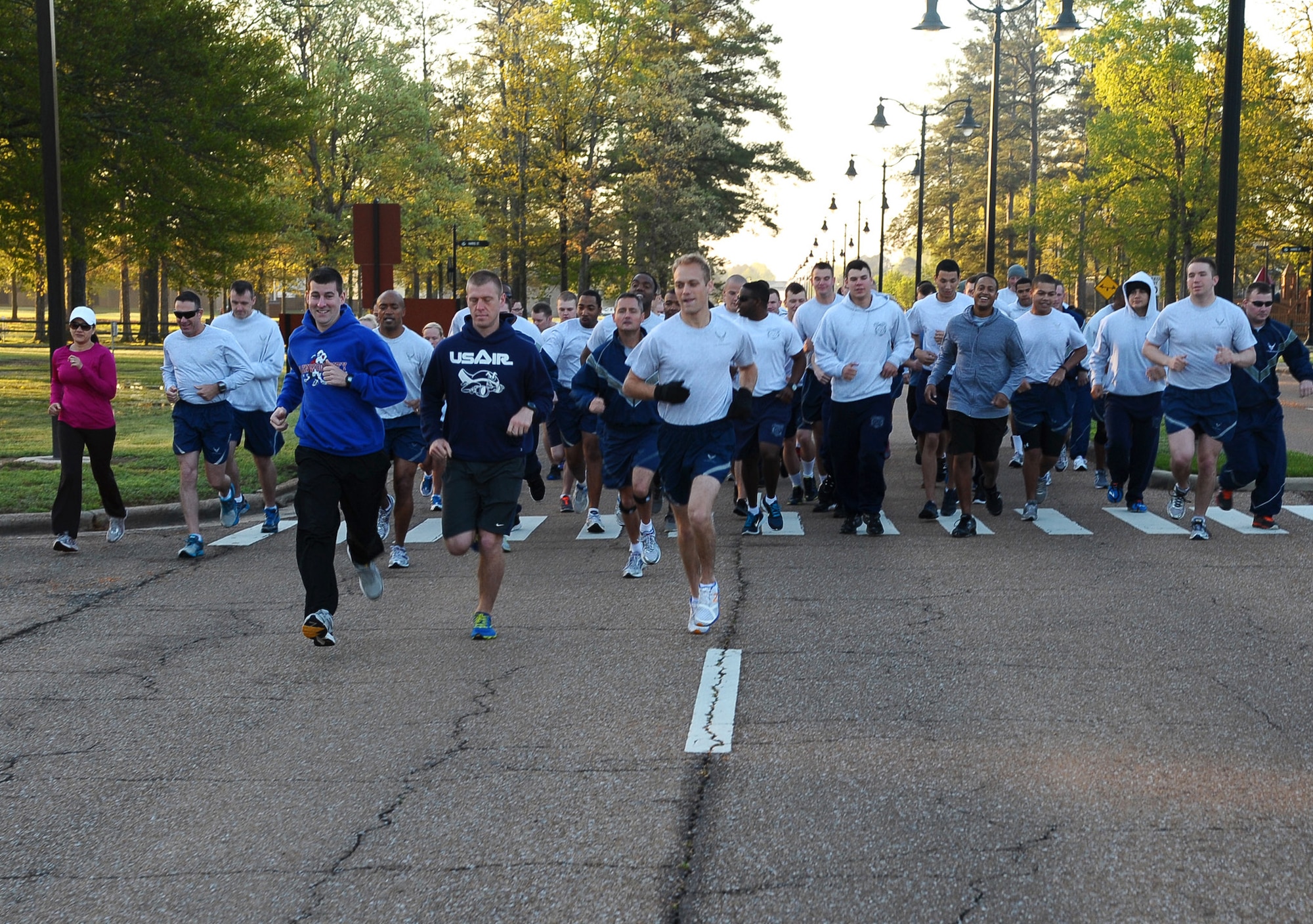 Personal Fitness photo- Airmen take off from the starting line in the Warrior 5k run April 12 during Sexual Assault Prevention and Response month on Columbus Air Force Base. The Fitness Center often hosts 5k runs for a multitude of different reasons, that range anywhere between awareness for social issues to fun group fitness. (U.S. Air Force Photo/Airman 1st Class Stephanie Englar)