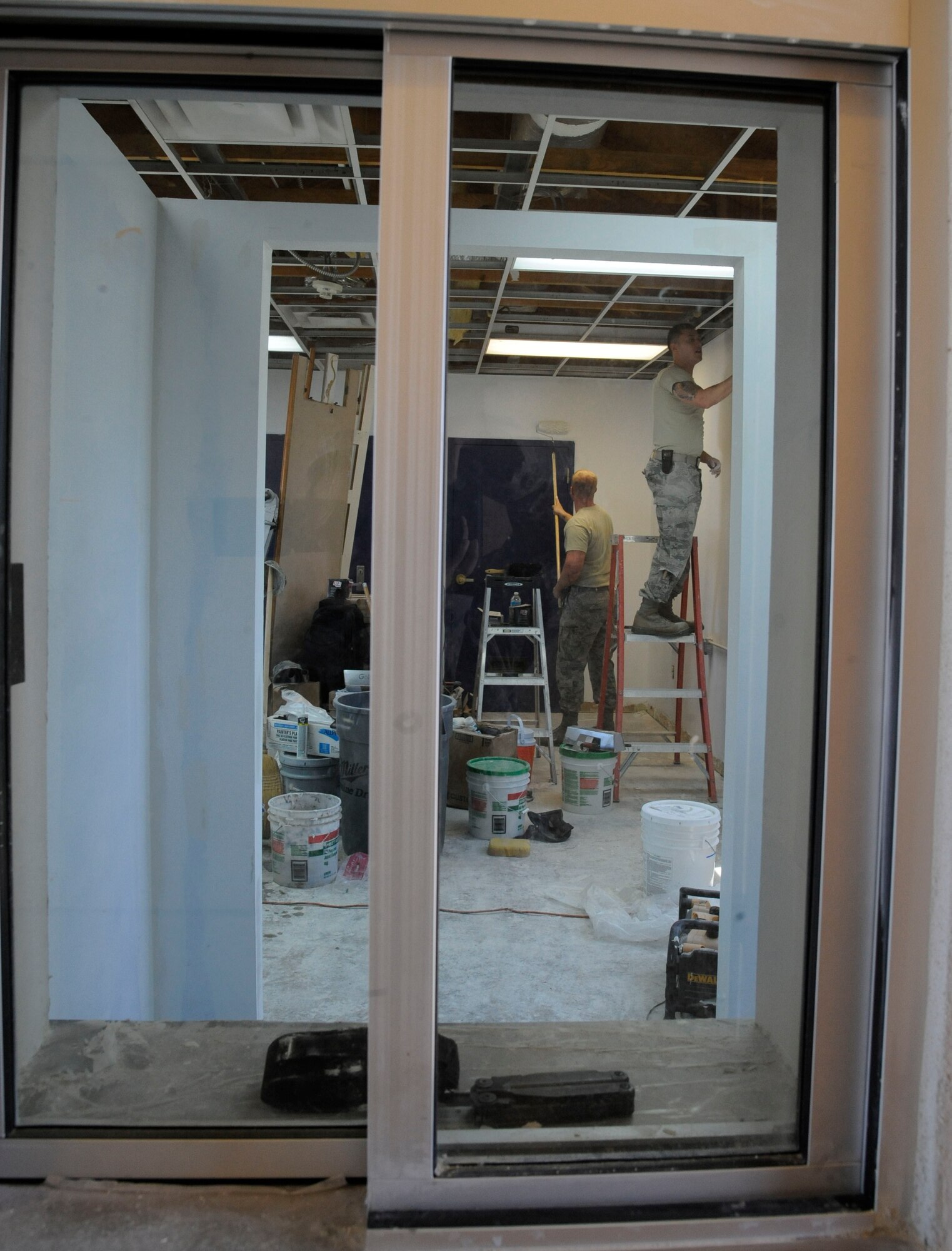 Airmen assigned to the 2nd Civil Engineer Squadron Structures shop, construct a concession stand during renovations of the pool at the Barksdale Club on Barksdale Air Force Base, La., April 22, 2013. The pool is currently undergoing renovations which include, replacing the barber shop with a concession stand, renovating bathrooms and the addition of large waterslides. The structures shop's responsibilities include roof repairs, replacing doors and glass, metal working, masonry and carpentry. (U.S. Air Force photo/Airman 1st Class Andrew Moua)