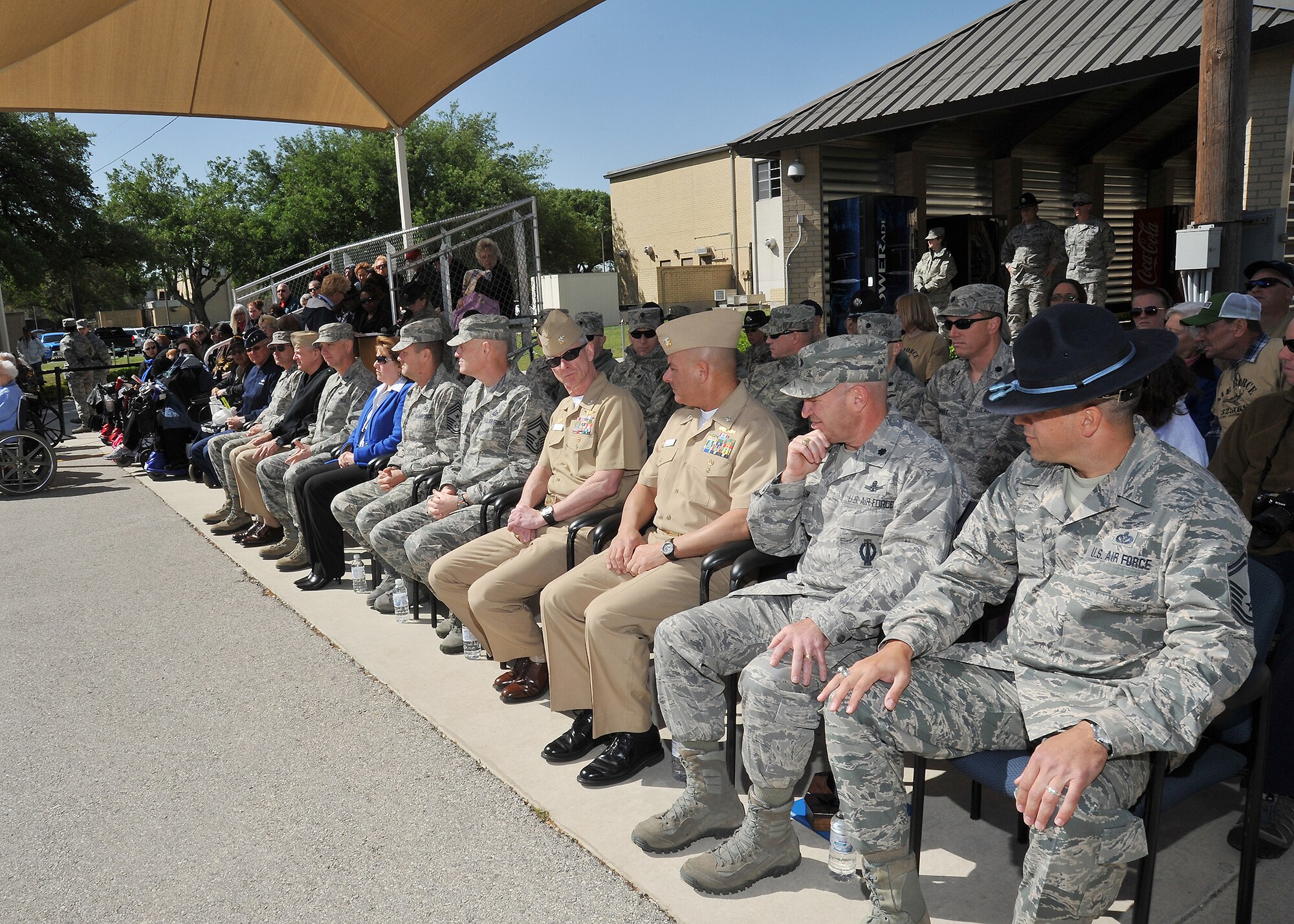 Earlier this month, sixteen Army, Navy, Air Force and Department of Defense officials met at Joint Base San Antonio- Lackland for the Council on Recruit and Basic Training Conference to discuss training and basic entry-level recruit operations across the services. The meeting was the first of its kind and aims to help all services share best practices. Officials were able to attend the Airman's Coin Ceremony as part of the three-day visit. (U.S. Air Force Photo/Alan W. Boedeker)