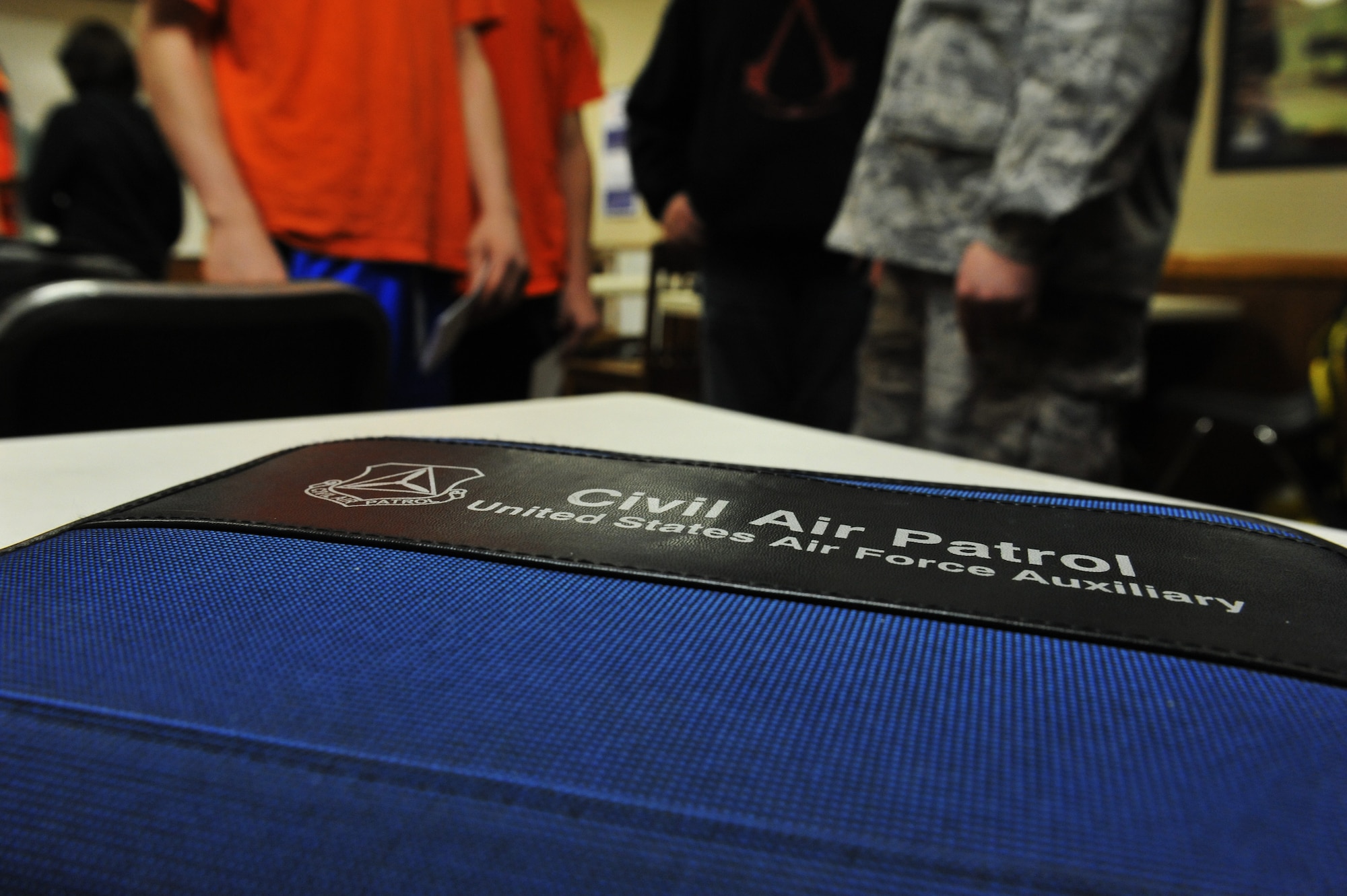 Members of Civil Air Patrol discuss events during their weekly meeting, March 28, 2013, in Sedalia, Mo. Meetings focus on leadership, aerospace education, character development and physical fitness. (U.S. Air Force photo by Heidi Hunt/Released)