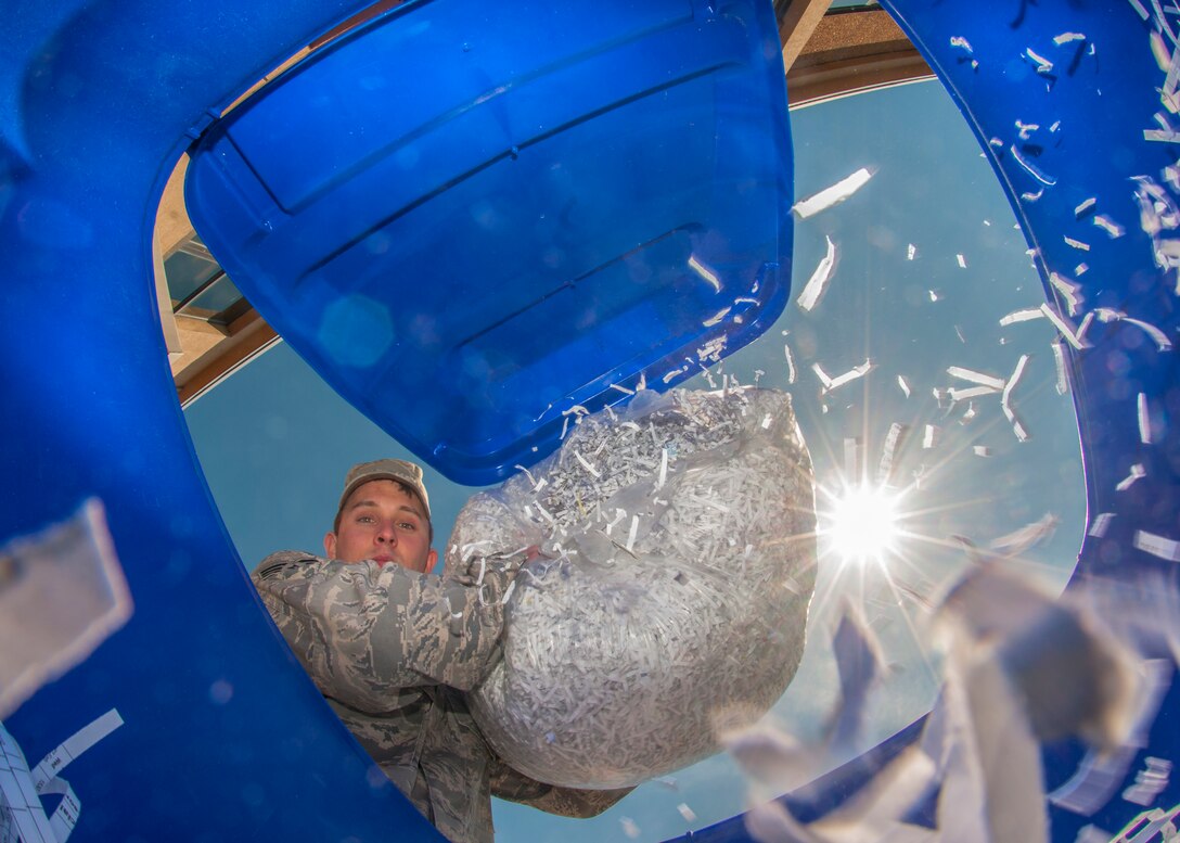 Senior Airman Nicholas Respondek, 914th Airlift Wing, recycles shredded paper on Earth Day, April 22, 2013,  at the Niagara Falls Air Reserve Station, N.Y. Throughout the year NFARS contributes by recycling many materials such as paper, cardboard, scrap metal, toner cartridges, computers, monitors, printers, other electronic waste, appliances, pallets, wood scraps, plastic wrap, plastic and glass beverage containers, batteries, used oil and filters, paint, light bulbs, ballasts and other recyclable construction and demolition debris. (U.S. Air Force photo by Tech. Sgt. Joseph McKee)