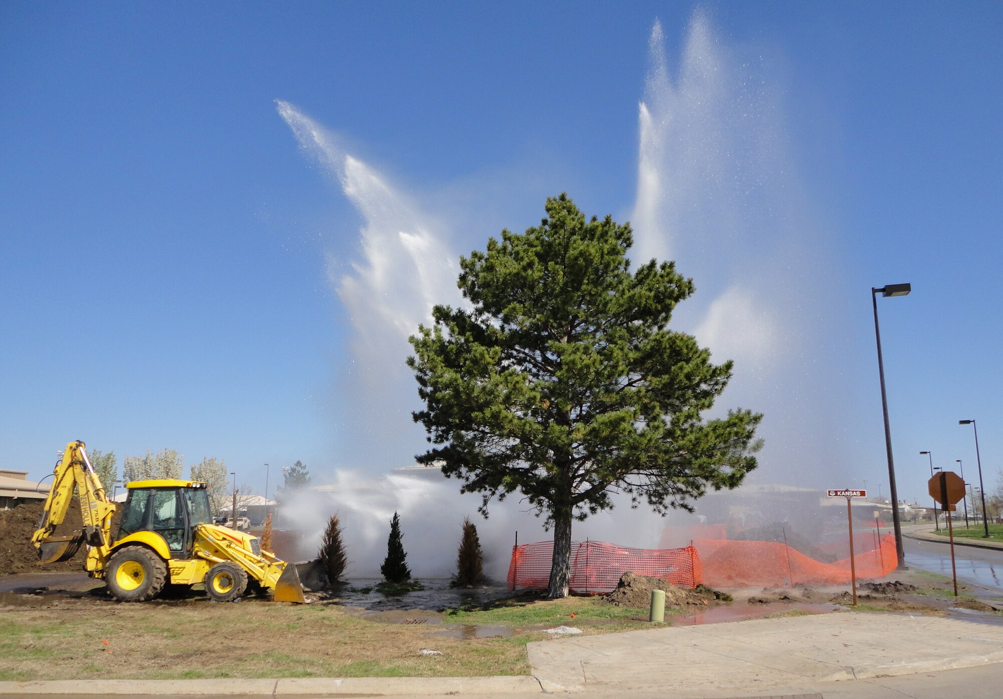 Water rushes into the air during water line repair work near the 931st Air Refueling Group Headquarters building, April 21. Local repair crews quickly repaired the water leak. (courtesy photo) 