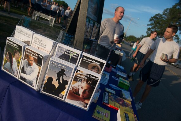 Airmen talk at the conclusion of a 5K run April 19, 2013, at Moody Air Force Base, Ga. The run kicked off an information fair that featured themes from April’s various awareness campaigns. (U.S. Air Force photo by Staff Sgt. Jamal D. Sutter/Released) 
