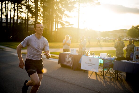 U.S. Air Force Airman 1st Class Kyle McNamara, 823d Base Defense Squadron fire team member, reaches a 5K-run finish line April 19, 2013, at Moody Air Force Base, Ga. McNamara was the first person to complete the run. (U.S. Air Force photo by Staff Sgt. Jamal D. Sutter/Released) 

