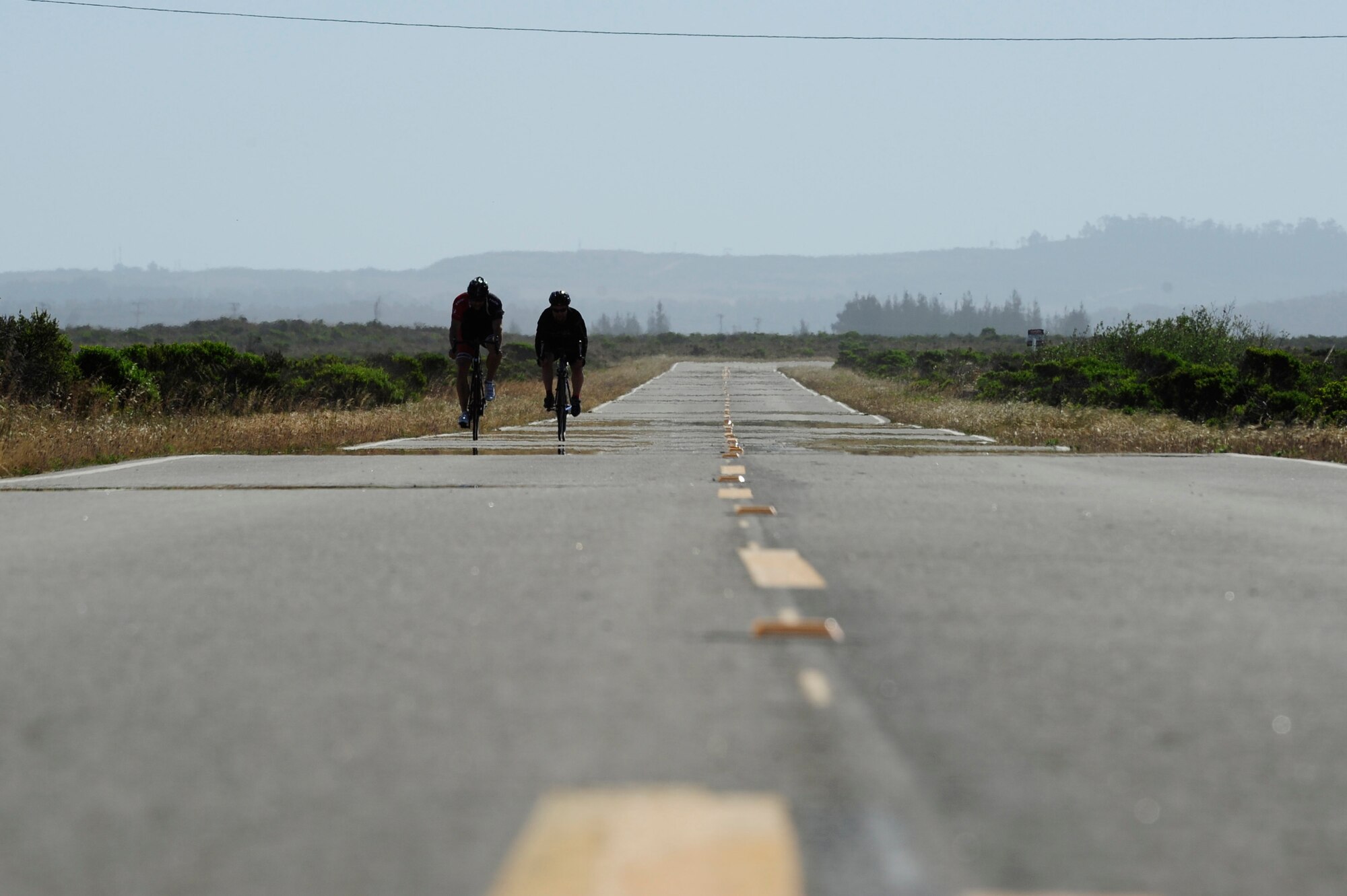 VANDENBERG AIR FORCE BASE, Calif. –Two Team V members race bicycles during the 12 km portion of a  duathalon here Saturday, April 20, 2013. The duathalon, sponsored by the 30th Force Support Squadron, consisted of a 5 km run, a 12 km bike and a 5 km run. (U.S. Air Force photo/Senior Airman Lael Huss)
