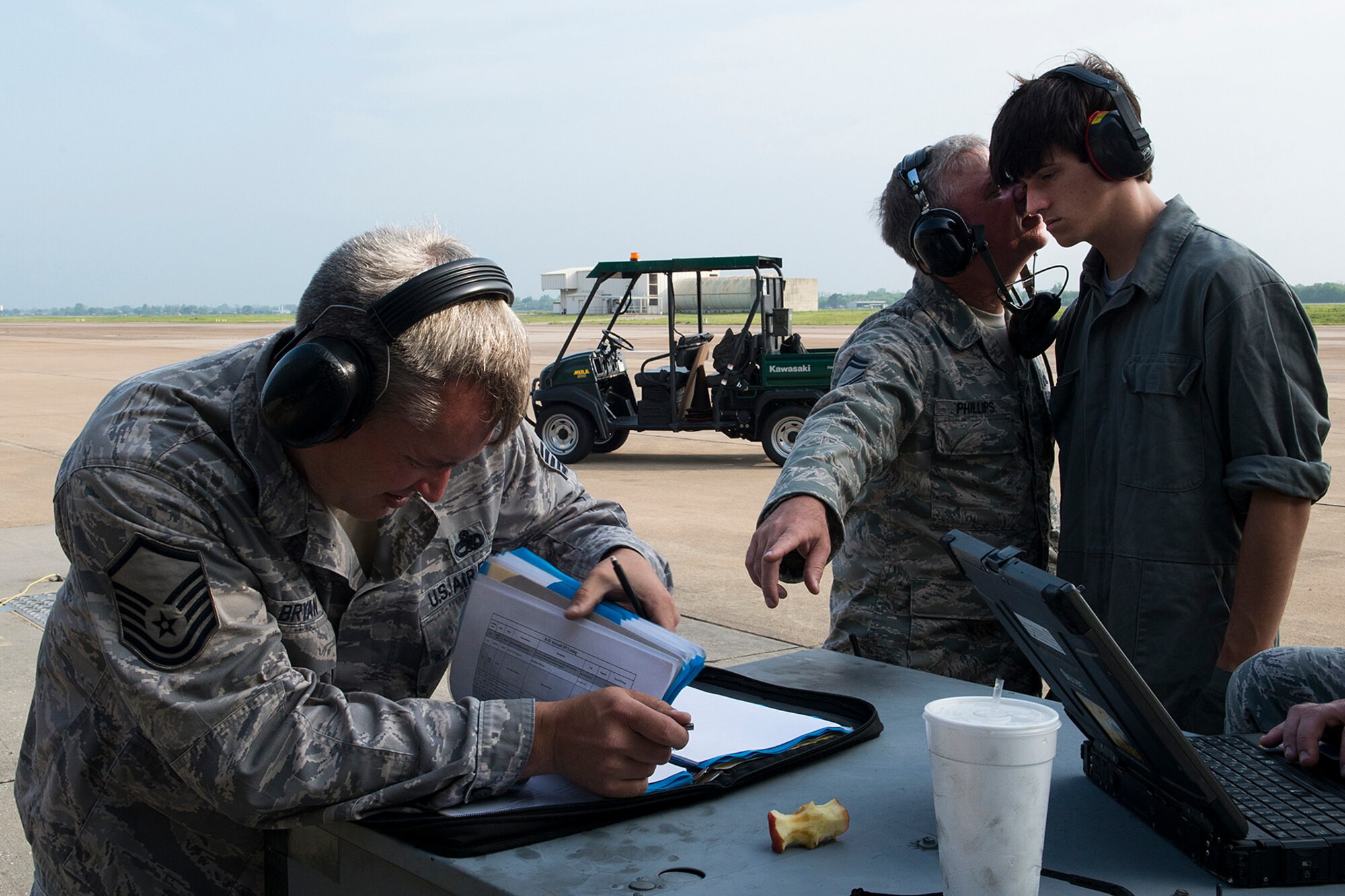 U.S. Air Force Senior Master Sgt. Wesley Phillips, 307th Aircraft Maintenance Squadron aircraft overhaul supervisor, explains to his son, Daniel, about updating aircraft forms after a maintenance task has been completed on a B-52H Stratofortress, April 17, 2013, Barksdale Air Force Base, La. Daniel, a Haughton High School senior, is working on a senior project which is focused on military aviation and the effects of drag on an aircraft. (U.S. Air Force photo by Master Sgt. Greg Steele/Released)