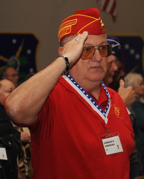 A Purple Heart recipient salutes during the 35th Annual Prisoner of War/Missing in Action Luncheon on Barksdale Air Force Base, La., April 19, 2013. The luncheon was held to honor 25 former Prisoners of War, 115 Purple Heart recipients and the family of Capt. Carl Jackson, Air Force Vietnam pilot still missing in action. (U.S. Air Force photo/Senior Airman Sean Martin)