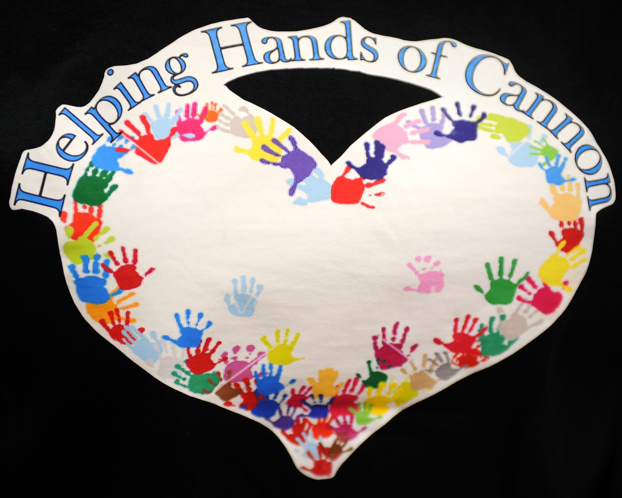 A shirt advertises the inaugural Cannon Helping Hands celebration at Cannon Air Force Base, N.M., April 19, 2013. Helping Hands was held to bring awareness about base programs available for military families. (U.S. Air Force photo/Airman 1st Class Ericka Engblom)