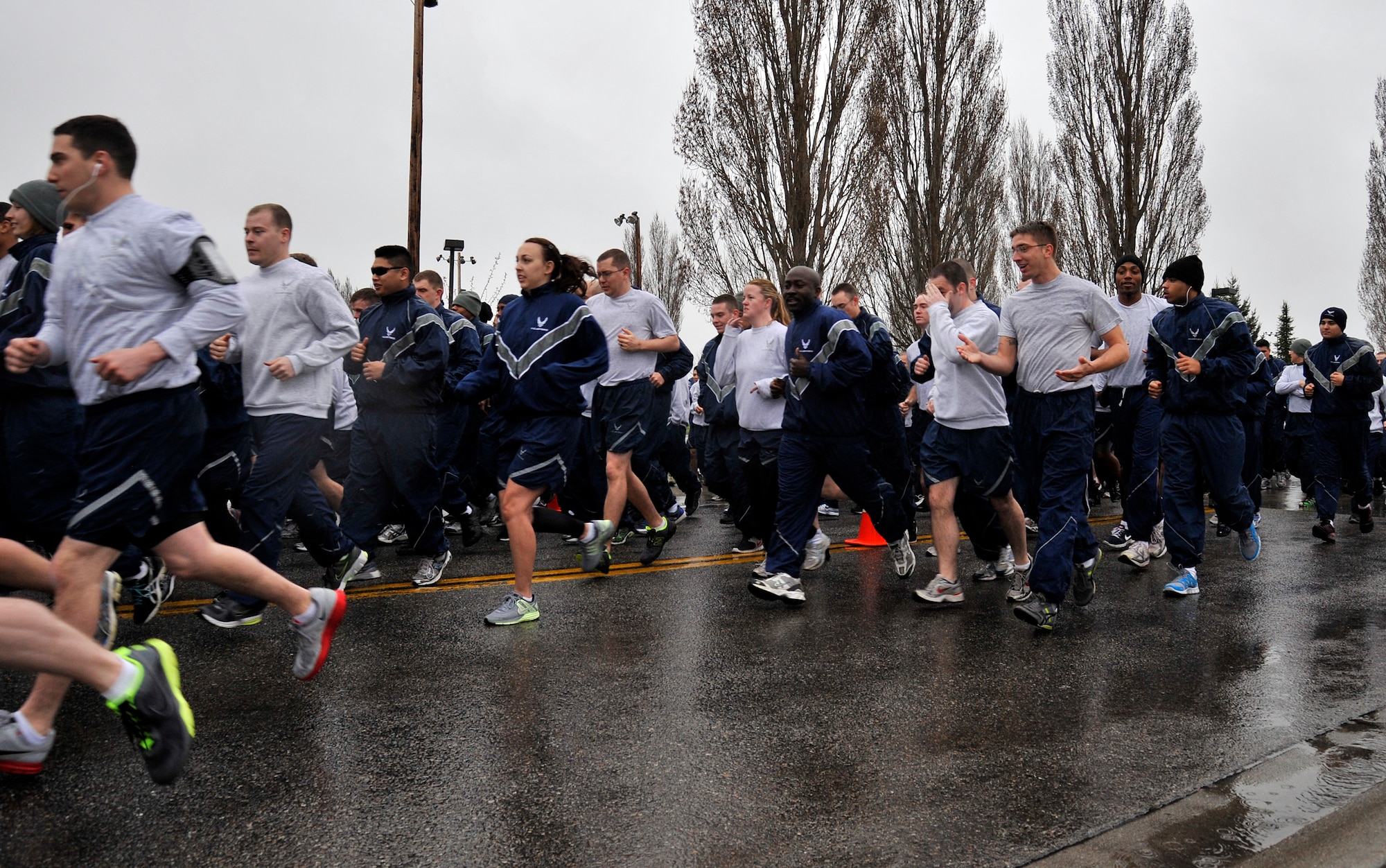 Participants run in honor for Sexual Assault Awareness Month on a designated route across Fairchild Air Force Base, Wash., April 19, 2013. The run was an event held to bring awareness for sexaul assualt. (U.S. Air Force photo by Airman 1st Class Janelle Patiño)