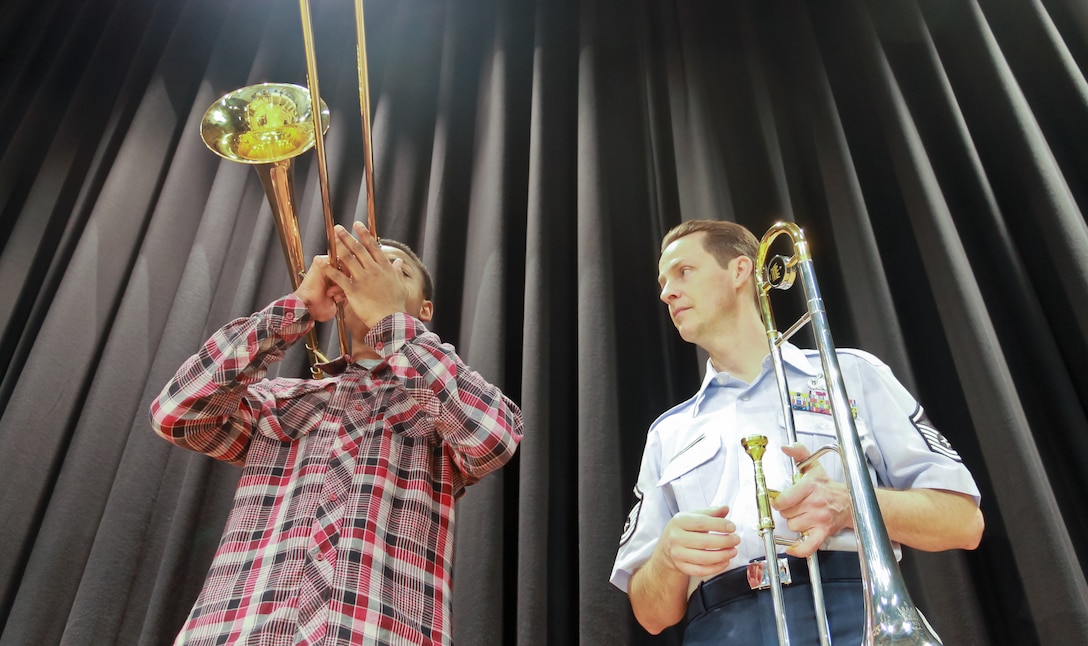 MSgt Charles Anderson mentoring a trombone student at Wiesbaden High School.  The Ambassadors performed for four DODDS schools in honor of Music in Our Schools.