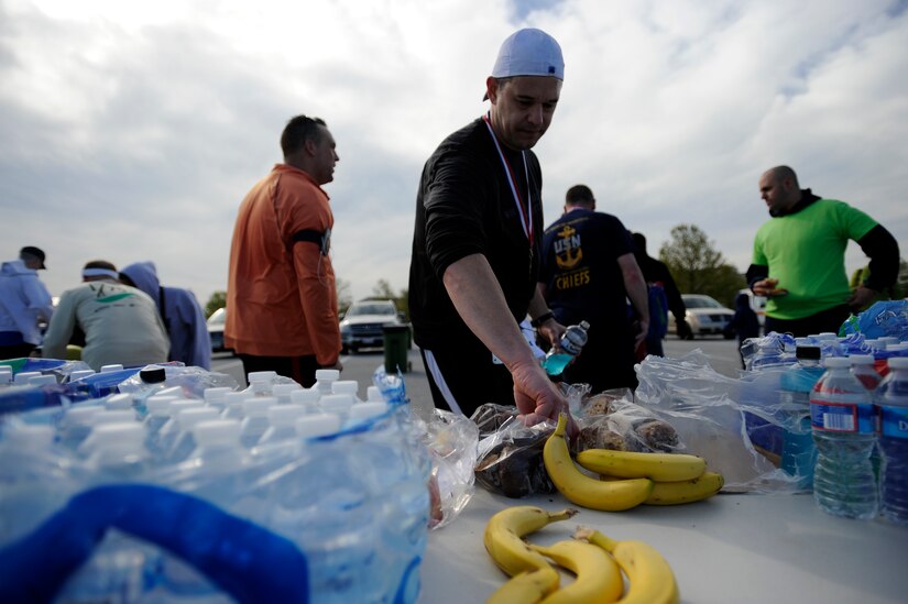 Runners eat snacks and drink water after completing the Joint Base Andrews Half Marathon April 13, 2013. A half marathon is 13.1 miles. (U.S. Air Force photo Staff Sgt. Brittany E. Jones)