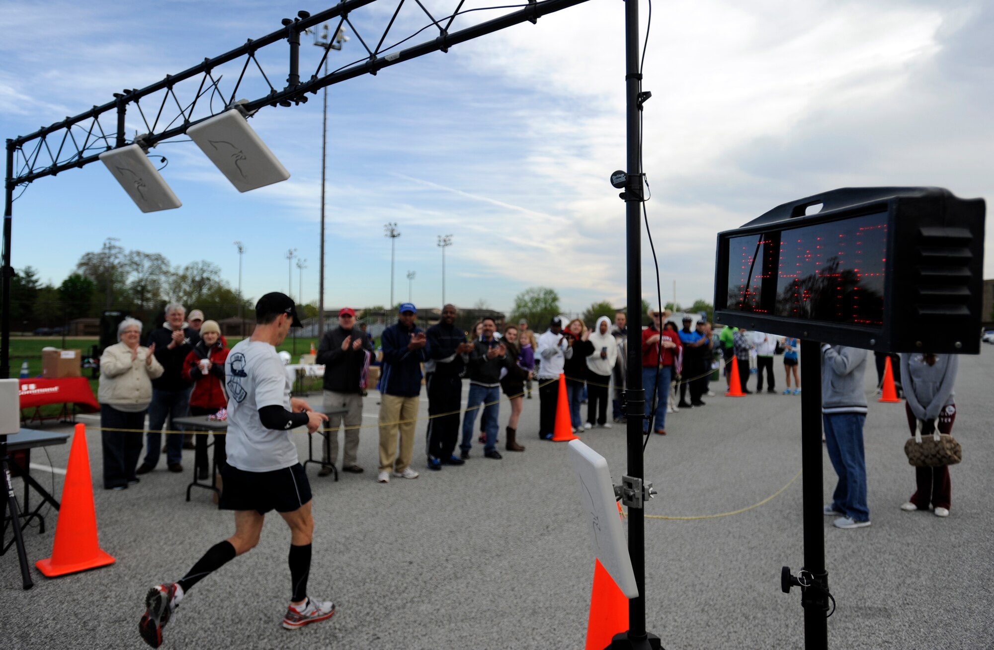Kristopher Epps, half marathon participant, crosses the finish line at one hour, 24 minutes and 48 seconds at Joint Base Andrews, Md., April 13, 2013. Epps was the first place male runner to finish the half marathon. (U.S. Air Force photo/Staff Sgt. Brittany E. Jones)