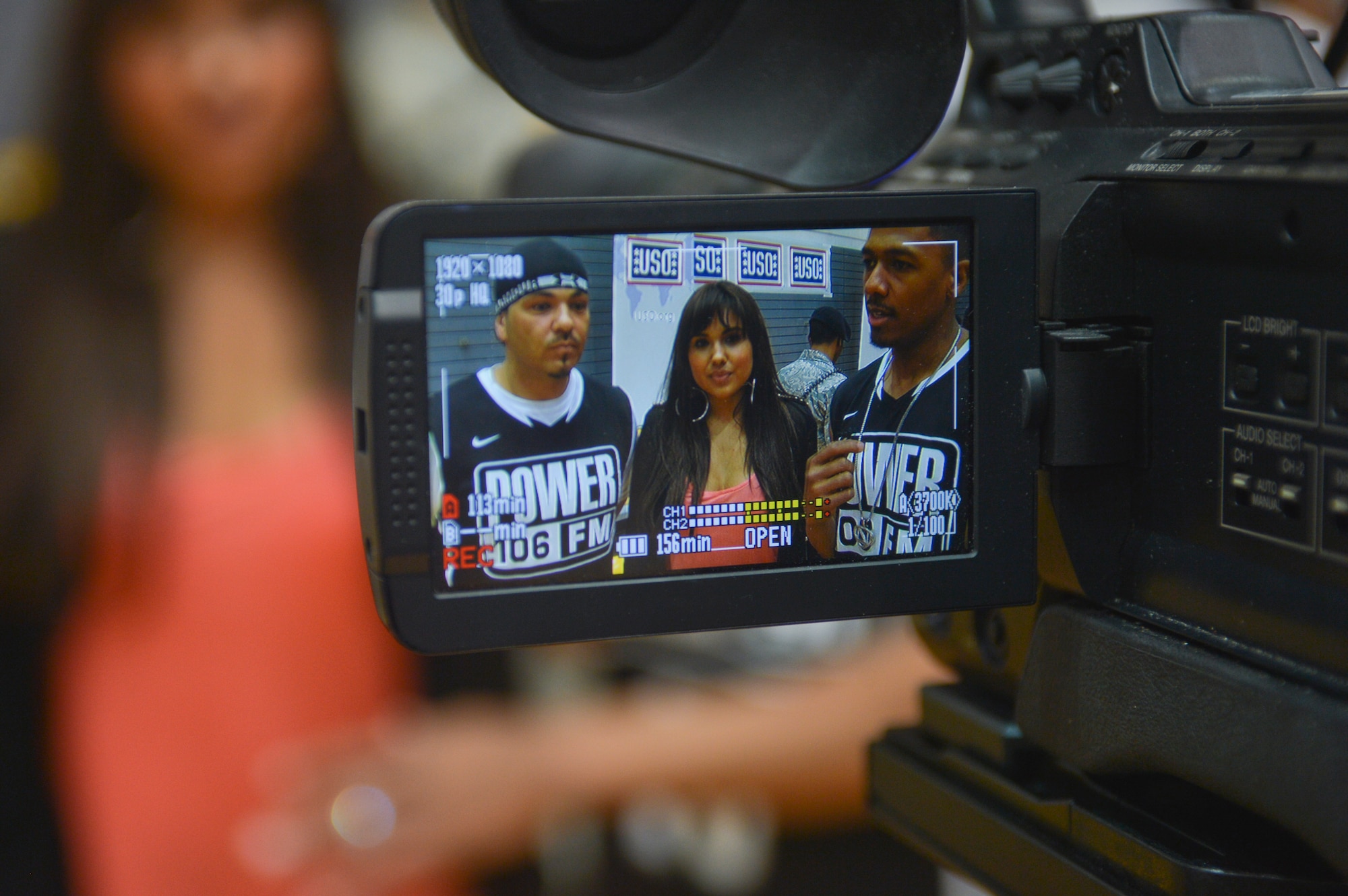 Baby Bash, Kristina DeBarge and Nick Cannon are interviewed after the Power 106 and Nick Cannon N 'Credible United Service Organization tour on Ramstein Air Base, Germany, April 19, 2013. USO's lineup included actors, musicians and comedians competing against Ramstein's finest basketball players in a morale event to show support to the troops. (U.S. Air Force photo/Airman 1st Class Jordan Castelan)