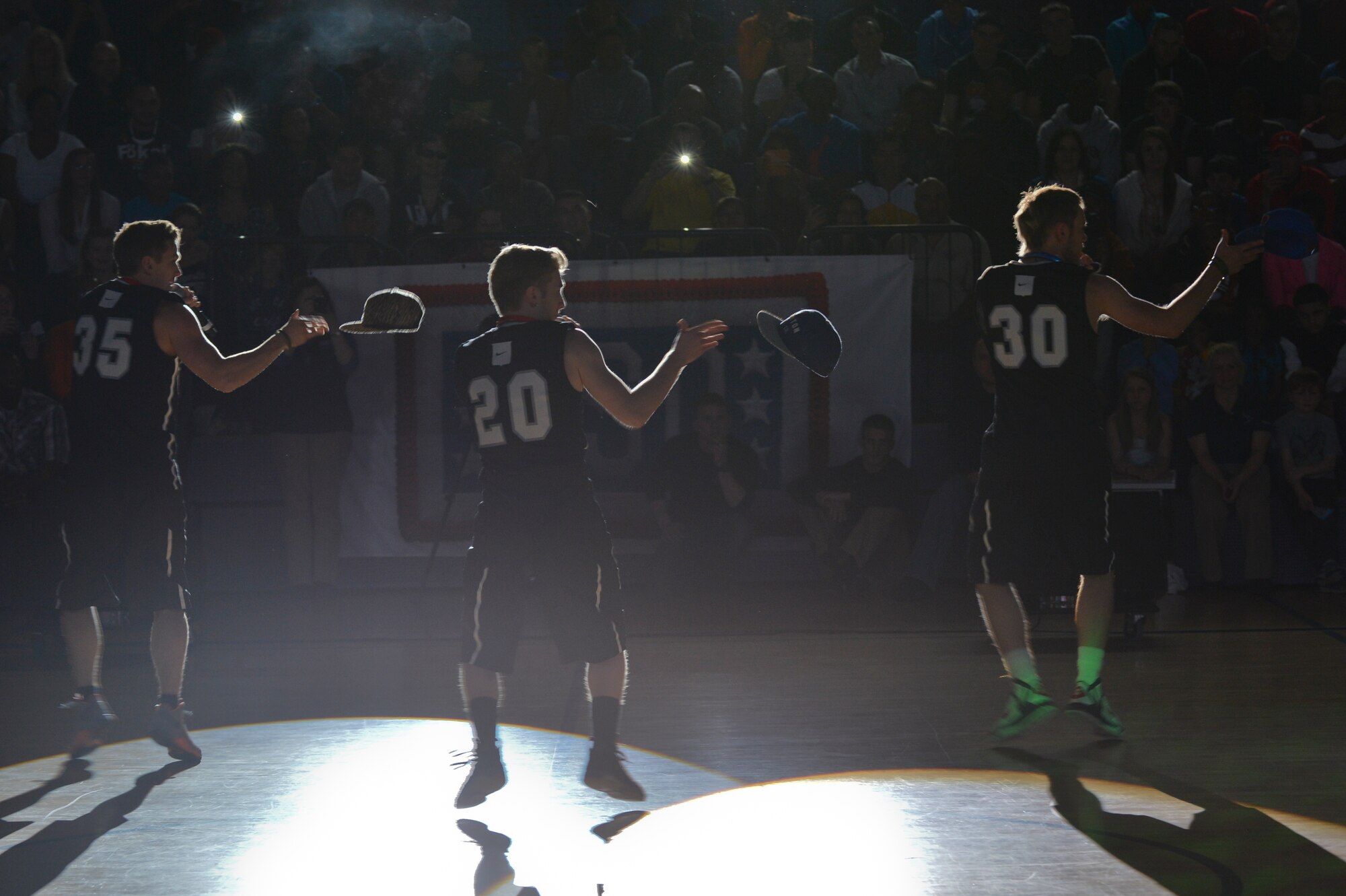 Members of 4 Count & PWD perform during halftime of the Power 106 and Nick Cannon N 'Credible United Service Organization tour on Ramstein Air Base, Germany, April 19, 2013. USO's lineup included actors, musicians and comedians competing against Ramstein's finest basketball players in a morale event to show support to the troops. (U.S. Air Force photo/Airman 1st Class Jordan Castelan)