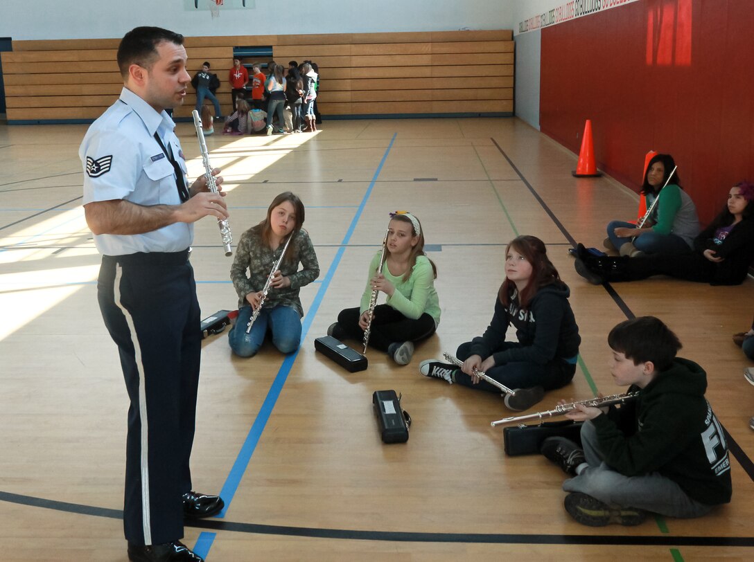 SSgt Lencys Esteban Nunez imparts his knowledge to Spangdahlem Middle School students during a woodwind clinic.  The Ambassadors performed for four DODDS schools in honor of Music in Our Schools. 