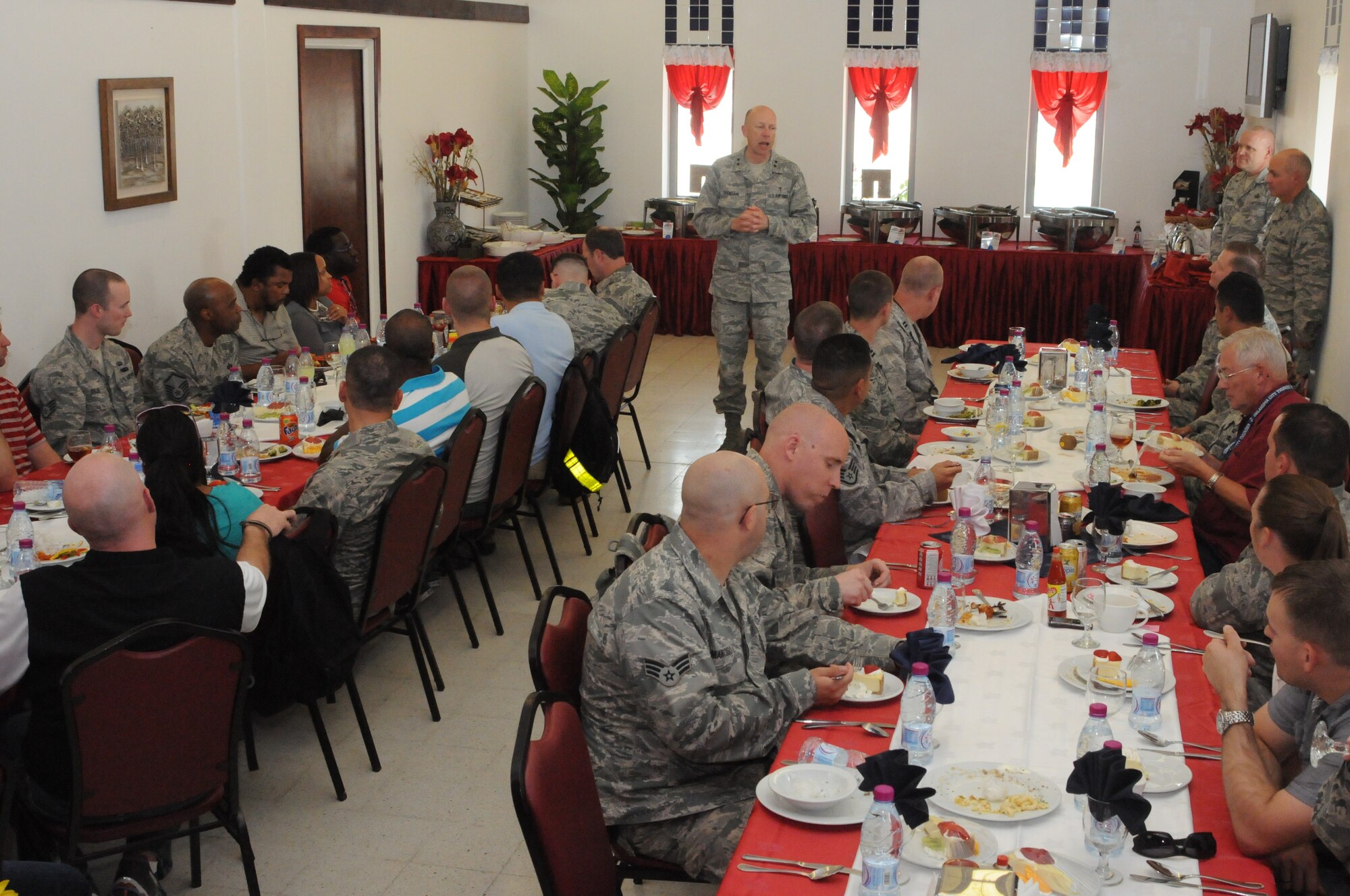 SOUTHWEST ASIA -- Air Force Chief of Chaplains Major General Howard Stendahl speaks during a luncheon of chapel volunteers in Southwest Asia April 14. Stendahl and Chaplain Assistant Career Field Manager Chief Master Sgt. Alton Clemmons visited the 379th Air Expeditionary Wing April 14-15, speaking with Airmen and touring chaplain programs supporting operations here. Stendahl thanked various volunteer and religious groups for their support of Airmen deployed to Southwest Asia. (U.S. Air Force photo/Master Sgt. Christian Michael)